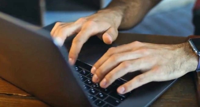 Hands on a laptop
